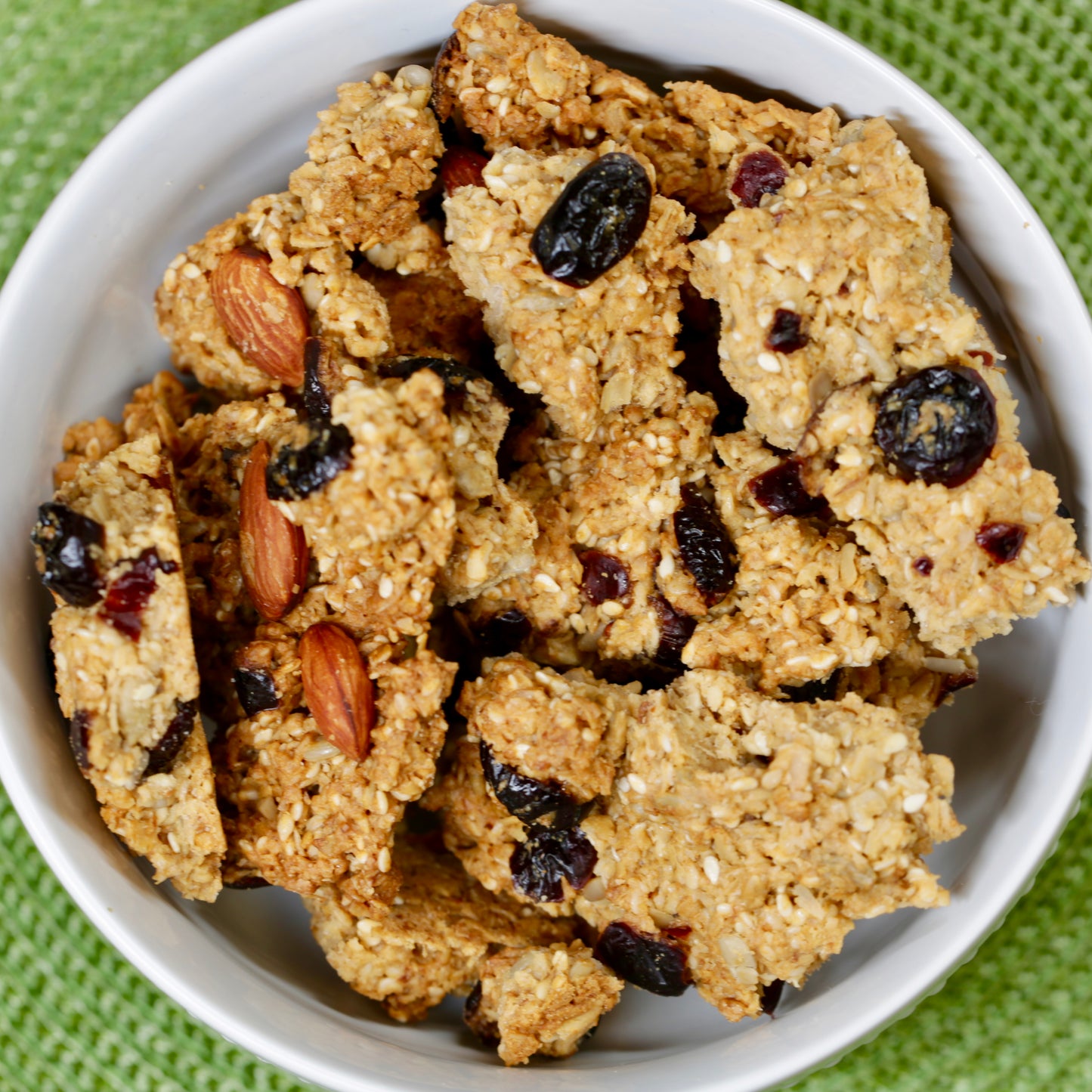 Big Sky Bread Company Whole Grain Granola. A whole grain oatmeal base featuring apple juice sweetened cranberries, California almonds, wildflower honey and a perfect blend of sesame and sunflower seeds.