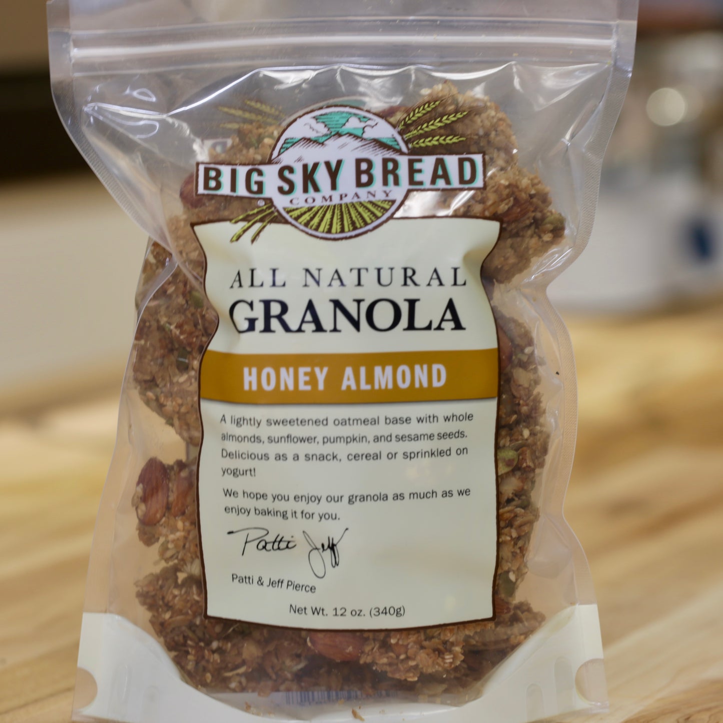Our original granola flavor. A lightly sweetened oatmeal base loaded with whole California almonds, wildflower honey, sunflower, sesame and pumpkin seeds. Big Sky Bread Company Whole Grain Granola.