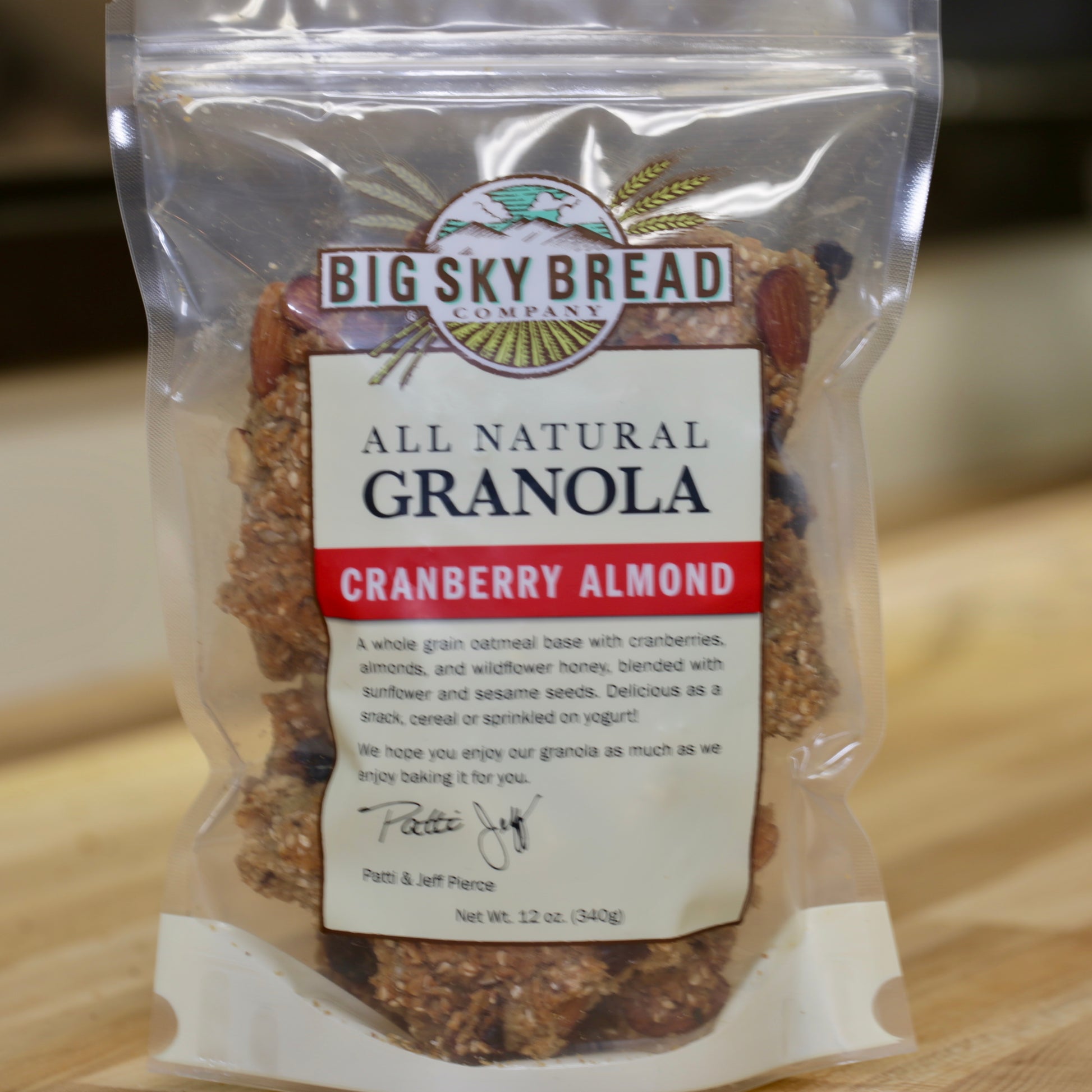 Big Sky Bread Company Whole Grain Granola. A whole grain oatmeal base featuring apple juice sweetened cranberries, California almonds, wildflower honey and a perfect blend of sesame and sunflower seeds.